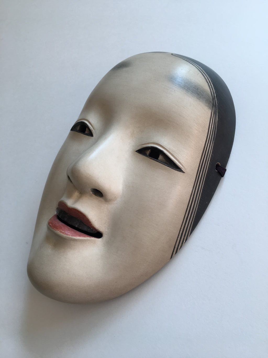 Mask of MAGOJIRO by Masahiko Matsumoto. /(with quilted textile bag and a paulownia box)