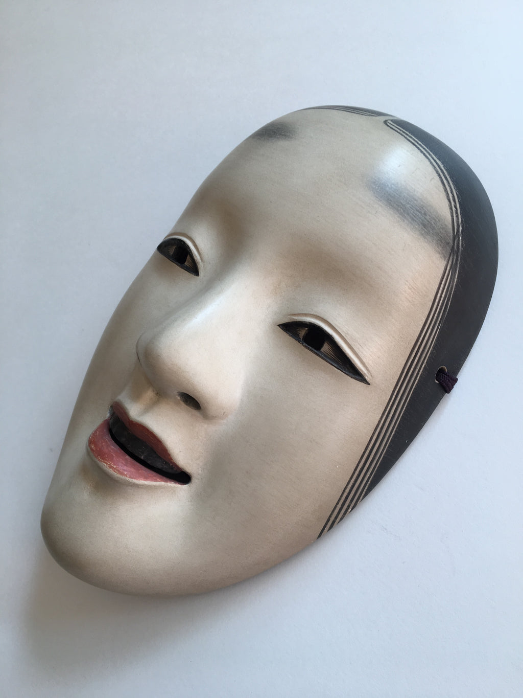 Mask of MAGOJIRO by Masahiko Matsumoto. /(with quilted textile bag and a paulownia box)